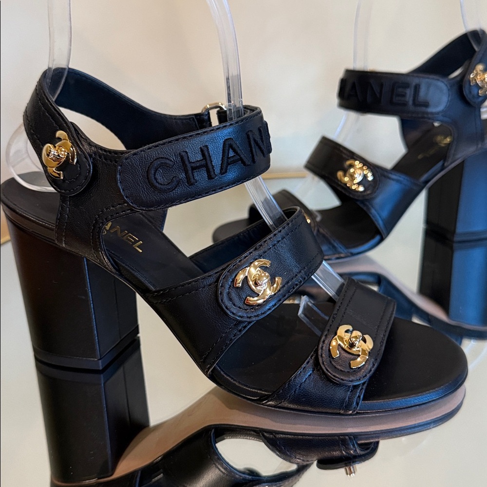 CHANEL Black leather logo Gold Turn-lock heeled sandals size 36.5